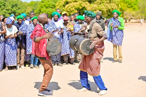 2royal drummers beating the royals drums called Mikupere