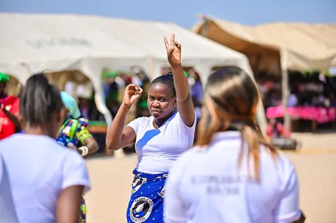 Different church choirs singing and dance at the dedication of the kwamshi bible