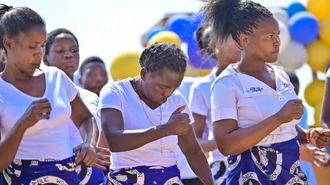Different church choirs singing and dance at the dedication of the kwamshi bible