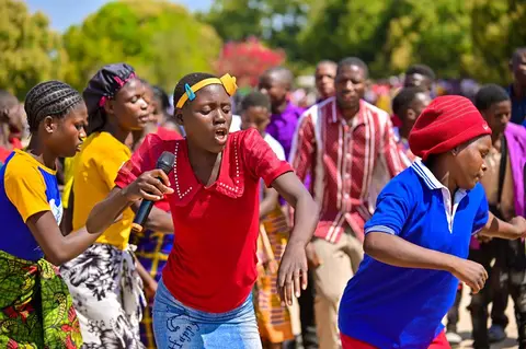 Different church choirs singing and dance at the dedication of the kwamshi bible
