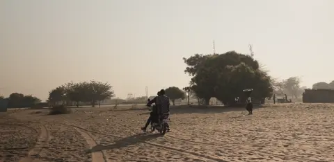 24.	A ground in Shangombo with people