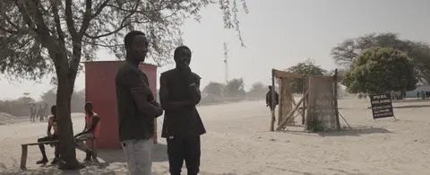2 young men hanging out at the shangombo ground