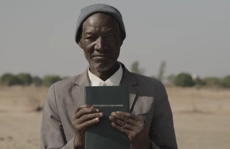 Man Holding the Kwamashi bible